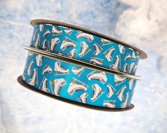 Figure Skates tossed on a blue background printed on 5/8" and 7/8" white satin ribbon