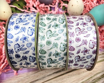 Easter Toile ribbon with bunnies, flowers, eggs and leaves in three colors raspberry, green and blue printed on 1.5" satin