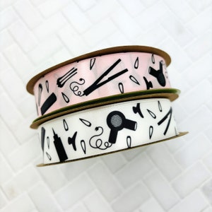 Hairdresser and Hair Stylist ribbon with elements of the trade  in black silhouette printed on 7/8" white or pink single face satin