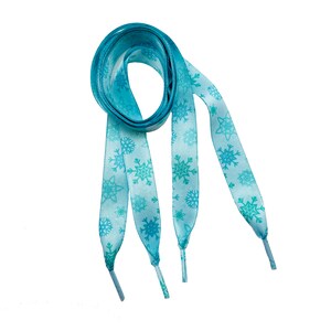 May include: A pair of light blue shoelaces with a snowflake pattern.