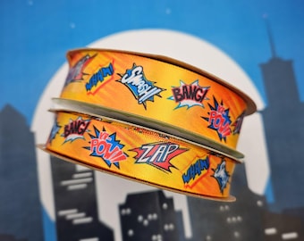 Super Hero Ribbon Zap, Pow, Bang, Smash, Wham on a bright orange background printed on 5/8" and 7/8" single face satin