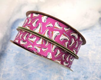 Figure Skates tossed on a pink background printed on 5/8" and 7/8" white satin ribbon