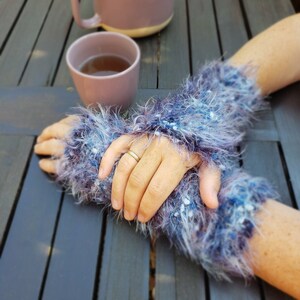 blue hand warmers made from great fringe yarn - hand knitted