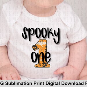 May include: A white baby bodysuit featuring the words "spooky one" in black. The number one is orange and decorated with Halloween motifs like bats and skulls. A fun outfit for a baby's first Halloween.
