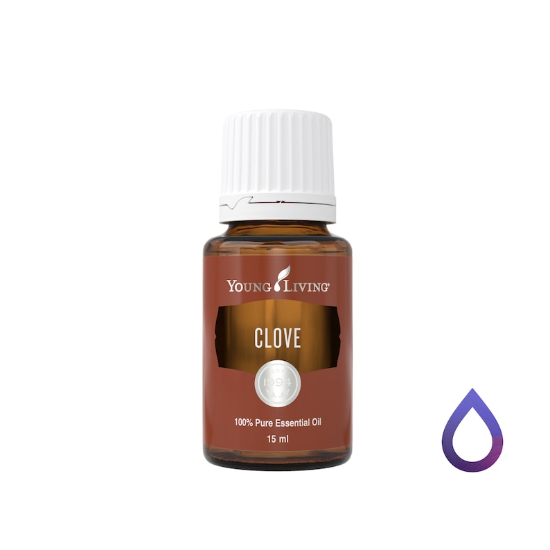 May include: A brown glass bottle of Young Living Clove 100% Pure Essential Oil. The bottle has a white cap and a brown label with the word "CLOVE" in white. The bottle contains 15 ml of oil.