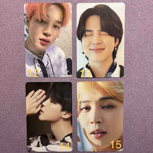May include: Four photo cards featuring a young man with different hairstyles and expressions. The cards are numbered 12, 13, 14, and 15.