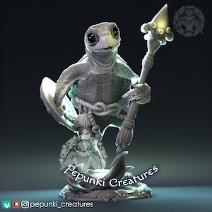 May include: A detailed 3D-printed sculpture of a turtle-like creature holding a staff with a glowing orb. The sculpture is in shades of gray and white, with intricate details. The base features a sea creature design, and the text "Pepunki Creatures" is visible.