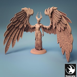 May include: A tan-coloured miniature figurine of a winged humanoid figure. The figure has large, ornate wings with intricate patterns, a horned headdress, and a flowing gown. The figurine is standing on a circular base.