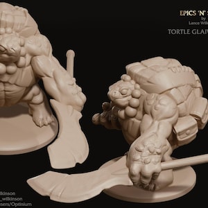 May include: Two beige 3D-printed figurines of a Tortle Glaive Master. The figures are muscular, with a turtle shell on their backs and holding a glaive. The text "EPICS 'N' STUFFS" and "TORTLE GLAIVE MASTER" are visible.