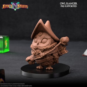 May include: A brown 3D-printed owl figurine, wearing a hat and ranger attire, standing on a black circular base. The figurine has detailed textures and is labeled "Owl Ranger Pre-Supported". The logo "Epics N Stuffs" is in the top left.