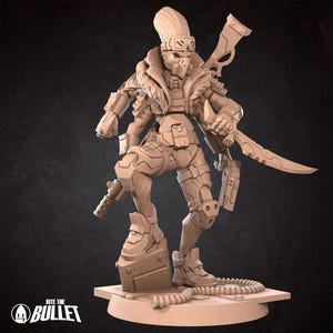 May include: A tan-colored figurine of a futuristic warrior, holding a sword and a gun. The figure is wearing armor and has a stylized skull-like face. The base of the figurine has the text "Bite the Bullet".