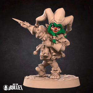 May include: A beige figurine of a jester with green hair, red lips, and a white and beige hat. The jester is holding a knife and a doll. The figurine is on a round base with the text "Into the Bullet".