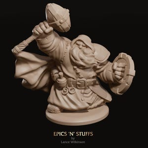 May include: A tan-coloured figurine of a dwarf, wielding a hammer and shield. The dwarf is clad in a hooded cloak, armour, and a belt with pouches. The base of the figurine features the text "EPICS 'N' STUFFS" and "Lance Wilkinson".