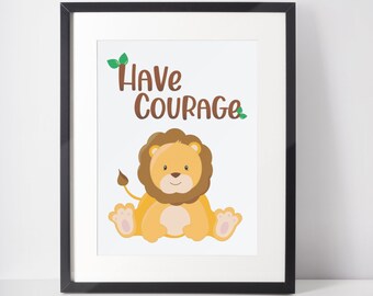 May include: Framed print featuring a cartoon lion with the words "Have Courage" in brown and green. The lion is yellow and tan, with a brown mane and tail. The frame is black.