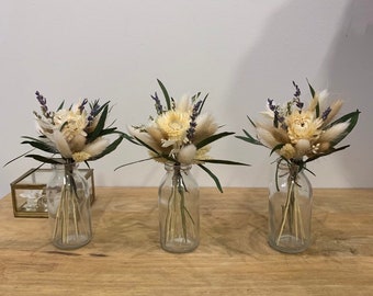 Trio of bouquets of dried flowers with soliflores