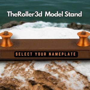May include: A brown wooden model stand with two copper colored rollers and a black nameplate that says "SELECT YOUR NAMEPLATE". The stand is on a white and brown rock surface.