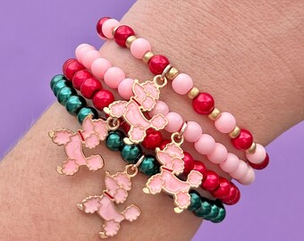 Roze poedelbedelarmbanden met kralen