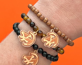 Pulseras de cuentas con dijes de Simba, el Rey León