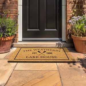 a door mat that says the weatherday is lake house