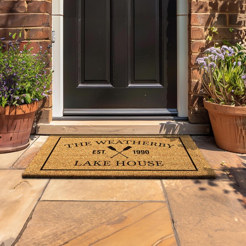 a door mat that says the weatherday is lake house