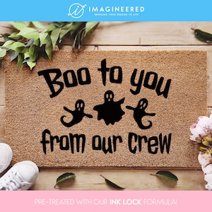 a door mat that says boo to you from our crew