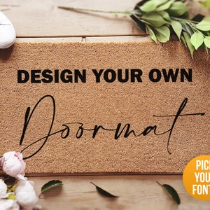a door mat with the words design your own on it