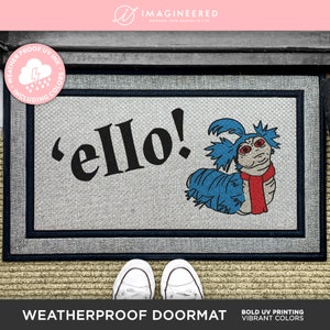 May include: Weatherproof doormat featuring a blue and red cartoon worm with the text 'ello!'.