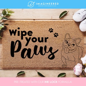 a door mat with the words wipe your paws on it