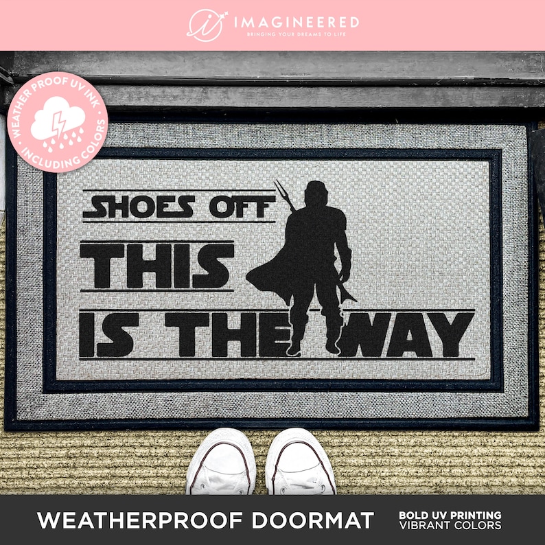 a door mat that says shoes off this is the way