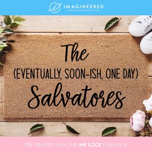 May include: A brown coir doormat with the text "The (EVENTUALLY, SOON-ISH, ONE DAY) Salvatores" in black lettering. The doormat is pre-treated with an ink lock formula.