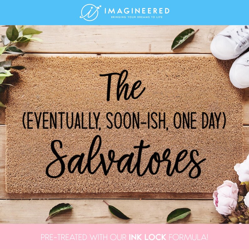 May include: A brown coir doormat with the text "The (EVENTUALLY, SOON-ISH, ONE DAY) Salvatores" in black lettering. The doormat is pre-treated with an ink lock formula.