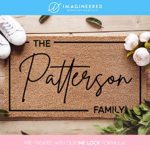 A durable coir doormat that is personalizable with family names