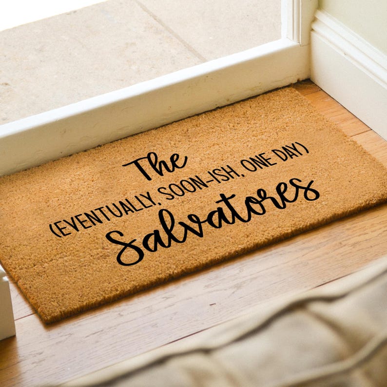 May include: A brown coir doormat with the text "The Salvatores (eventually, soon-ish, one day)" in black lettering.
