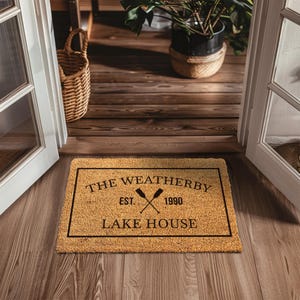 a door mat that says the weatherby estate lake house