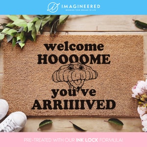 a welcome mat with a picture of a dog on it