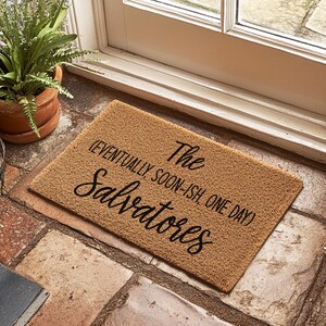 May include: A brown coir doormat with the text "The Salvatores (eventually soon-ish one day)" in black cursive lettering.