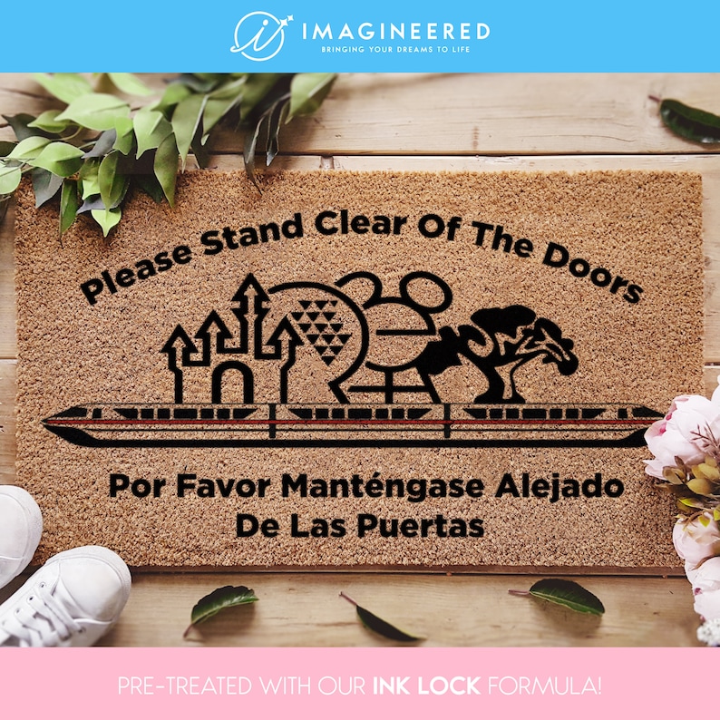 a door mat with the words please stand clear of the doors