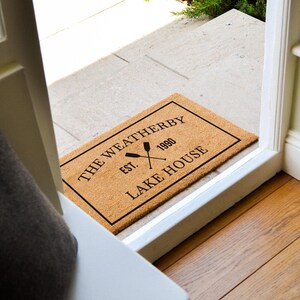 a door mat that says the weatherberry by lake house