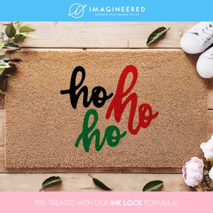 a door mat with the words ho hoo painted on it