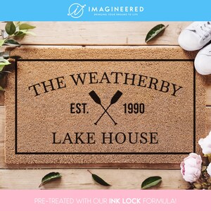 a door mat with the words, the weatherby, and two crossed oars