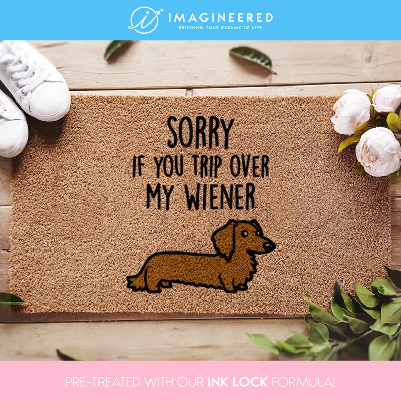 a door mat that says sorry if you trip over my wiener