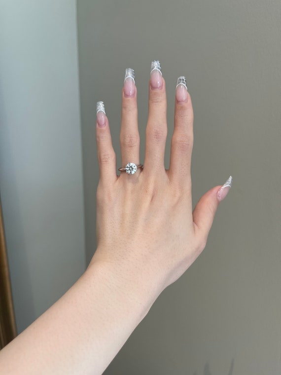 Tiffany ring on sale hand