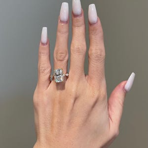 5 Carat Brilliant Radiant Cut Moissanite 4-Prong Hidden Halo Pavé Basket w/ Brilliant Pear Moissanite Pavé Engagement Ring, Solid Gold