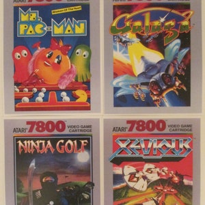 Atari 7800 Video Game Box Art Reproduction Four 8.5x11 Poster Prints - Ms. Pac-Man, Galaga, Ninja Golf, Xevious - Vintage Game Poster Decor. Atari vintage video game cover art from the Atari 2600 retro game console.