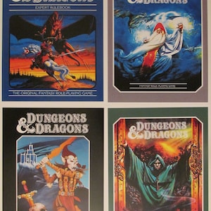 May include: Four different covers for Dungeons & Dragons role-playing game books. The covers feature illustrations of a dragon, a wizard, a warrior, and a hooded figure.