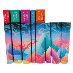 May include: A collection of eight books by Sarah J. Maas arranged side-by-side. The spines feature a vibrant, stippled gradient design in shades of blue, pink, orange, and yellow, depicting abstract mountain and cloud shapes with Roman numerals.