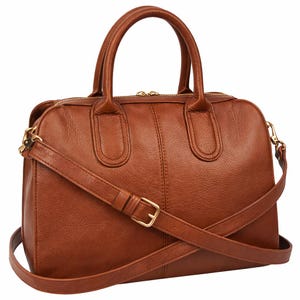 May include: A brown leather handbag with a top handle and a detachable shoulder strap. The bag features a gold-coloured zipper and buckle, and a textured surface. The bag is designed with a classic, structured shape.