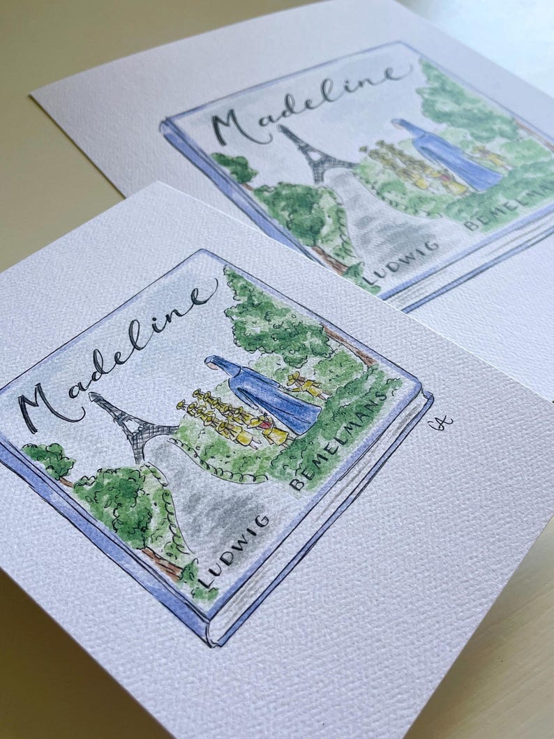 May include: Watercolor illustration of the book "Madeline" by Ludwig Bemelmans. The cover art features the Eiffel Tower, a group of girls, and a blue-robed figure. The title is written in cursive script. The artwork is on a white paper.