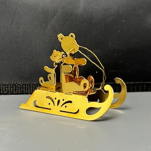 Danbury Mint Christmas ornament / 1984 Danbury Mint bears on a sled Christmas ornament.