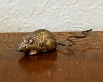 Vintage metal mouse figurine or paperweight.